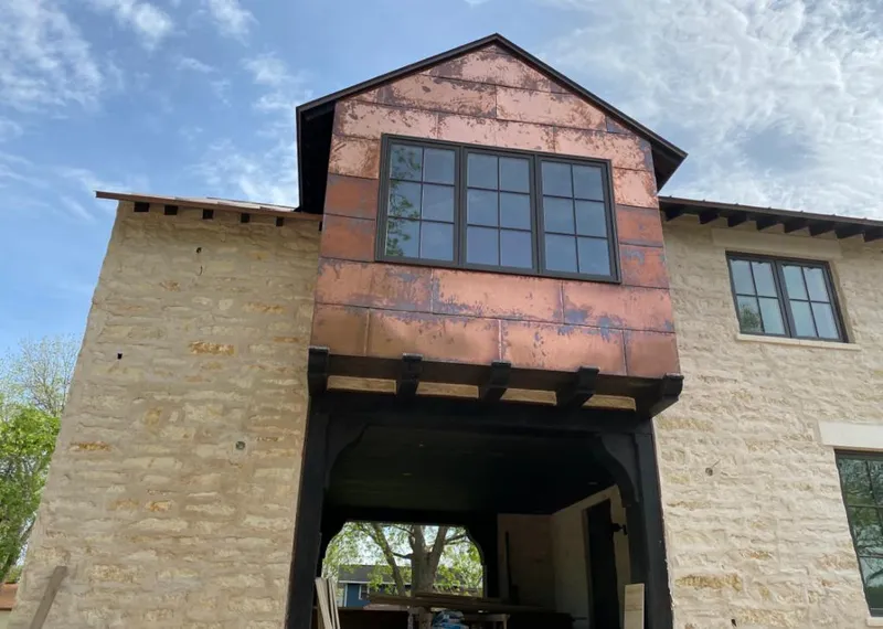 Copper metal panel facade on a stone building for Roof Repair in Parsippany-Troy Hills